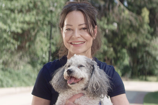 Jenn smiling, holding dog - #WeLoveAHealthyLA