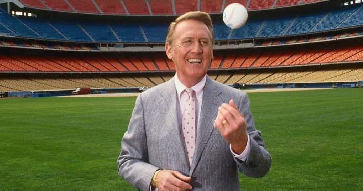 Baseball announcer Vin Scully tossing up a baseball while standing on a baseball field - #WeLoveAHealthyLA
